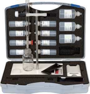 Transport case with reagents for total hardness determination by titration, including a burette to perform multiple sample analyses in a short time.